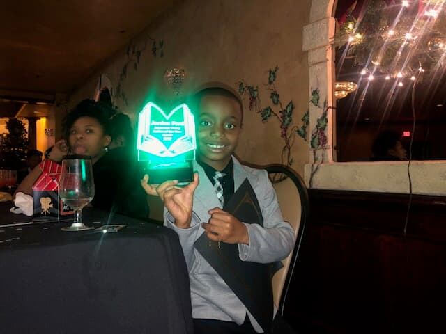 Young author celebrating at an Awesome Young Authors event